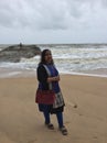 A young Indian woman posing at Kundapura beach Royalty Free Stock Photo