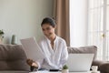 Young Indian woman read paper notification feels happy Royalty Free Stock Photo