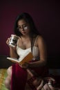 Young  Indian woman standing in front of a window/balcony Royalty Free Stock Photo