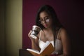 Young  Indian woman standing in front of a window/balcony Royalty Free Stock Photo