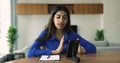 Indian woman talks using videocall application on smartphone