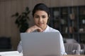 Young Indian woman work on laptop at home office Royalty Free Stock Photo