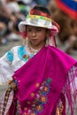 Young indigenous girl dressed in bright clothes in Ecuador