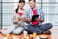 Young indonesian couple having breakfast