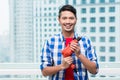 Young indonesian man with power drill