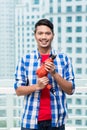 Young indonesian man with power drill