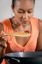 Young Indonesian woman testing the food