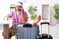 Young injured man preparing for the trip Royalty Free Stock Photo