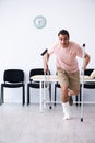 Young injured man waiting for his turn in hospital hall Royalty Free Stock Photo