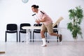 Young injured man waiting for his turn in hospital hall Royalty Free Stock Photo