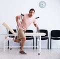 Young injured man waiting for his turn in hospital hall Royalty Free Stock Photo