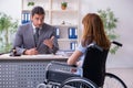 Young injured woman and male lawyer in the courtroom Royalty Free Stock Photo