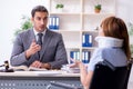 Young injured woman and male lawyer in the courtroom Royalty Free Stock Photo