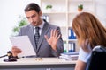 Young injured woman and male lawyer in the courtroom Royalty Free Stock Photo