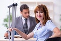 Young injured woman and male lawyer in the courtroom Royalty Free Stock Photo