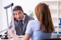 Young injured woman and male lawyer in the courtroom Royalty Free Stock Photo