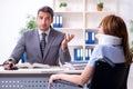 Young injured woman and male lawyer in the courtroom Royalty Free Stock Photo