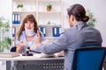 Young injured woman and male lawyer in the courtroom