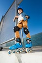 Young inline skater in helmet posing at skate park Royalty Free Stock Photo
