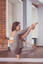 Young instructor practicing yoga