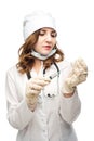 Young girl nurse in glasses prepares syringe Royalty Free Stock Photo