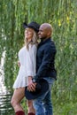 A Beautiful Young Interracial Couple Pose For Their Engagement Photographs Outdoors Royalty Free Stock Photo