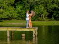 A Beautiful Young Interracial Couple Pose For Their Engagement Photographs Outdoors Royalty Free Stock Photo