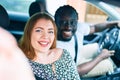 Young interracial couple smiling happy making selfie by the camera at the car Royalty Free Stock Photo