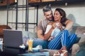 Young interracial couple spending time in cafe Royalty Free Stock Photo