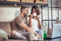 Young interracial couple spending time in cafe Royalty Free Stock Photo