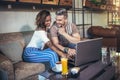 Young interracial couple spending time in cafe Royalty Free Stock Photo