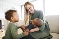 Young interracial family with little children at home. Royalty Free Stock Photo