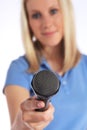 Young interviewer holding a microphone Royalty Free Stock Photo