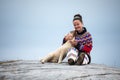 Young inuit woman in traditional clothing posing for photos in a small Greenlandish village. Royalty Free Stock Photo