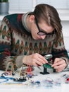 Young inventor examing electronic component Royalty Free Stock Photo