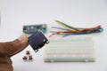 Young inventor holding OLED display in hand, Arduino display module with breadboard and wires on background showing creative Royalty Free Stock Photo