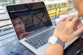 Young investor watching the change of stock market on laptop Royalty Free Stock Photo