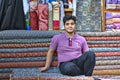 A young Iranian trader in fabric store, Shiraz, Iran.