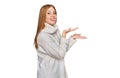 Young irish woman wearing casual winter sweater pointing aside with hands open palms showing copy space, presenting advertisement Royalty Free Stock Photo