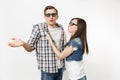 Young irritated dissatisfied couple, woman and man in 3d glasses and casual clothes watching movie film on date