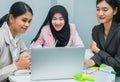young islam women happy using laptop with colleague in office meeting