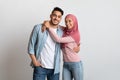Young Islamic Family. Happy Muslim Spouses Embracing And Smiling At Camera Royalty Free Stock Photo