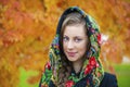 Young Italians in coat and knit a scarf on her head Royalty Free Stock Photo