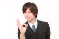 young Japanese businessman showing perfect sign Royalty Free Stock Photo