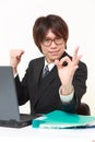 Young Japanese businessman showing perfect sign Royalty Free Stock Photo