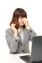 Young Japanese businesswoman suffers from Asthenopia