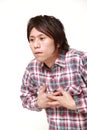 Young Japanese man heart attack Royalty Free Stock Photo