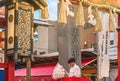 Young Japanese priest blessing the faithful at the Shinto Ootori shrine during the Tori-no-Ichi Fair or Rake fair.