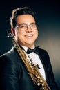 Young Japanese Saxophone Player Posing With Soprano Straight Saxophone.Musician with Brass Musical Instrument. Close-up