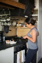 Young Japanese woman cooking eggs Royalty Free Stock Photo